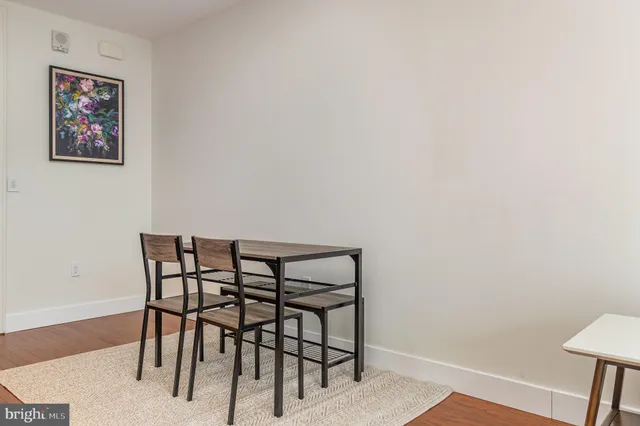 a view of a room with furniture and wooden floor