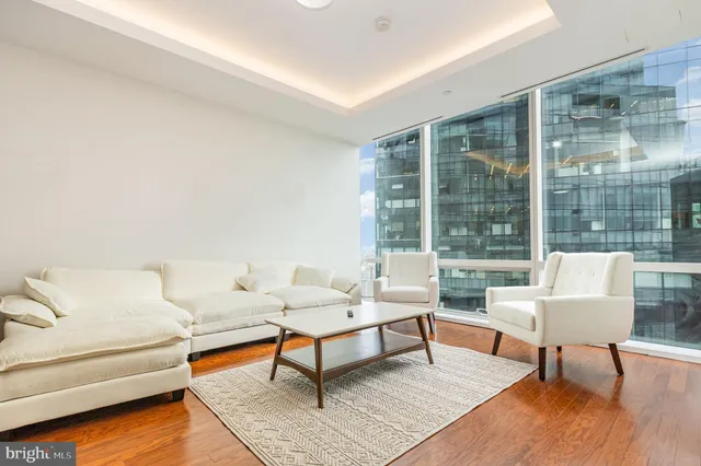 a living room with furniture and a rug