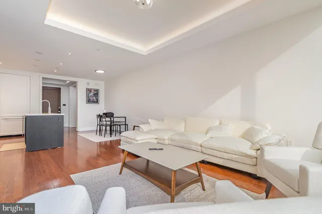 a living room with furniture and a table