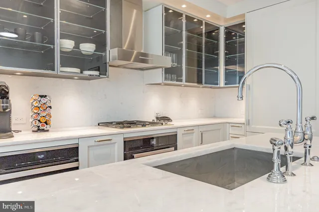 a kitchen with a sink cabinets and window