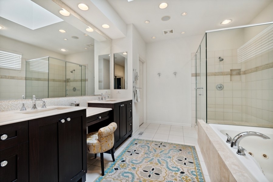 769 Endicott Road Highwood, IL 60040 - Photo 9 of 18 a spacious bathroom with a bathtub shower sink double and mirror