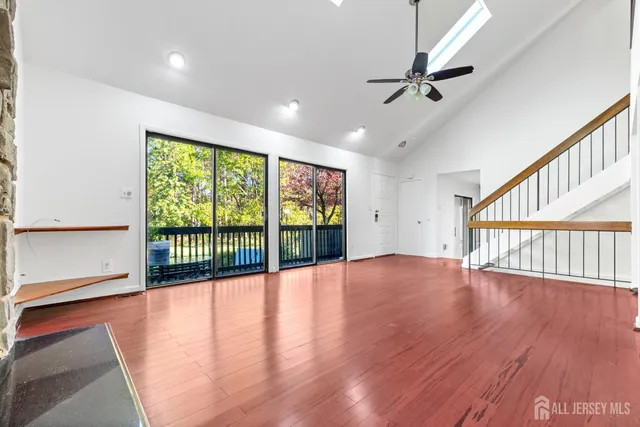a view of an entryway with wooden floor