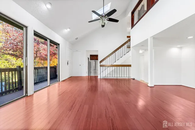 a view of an entryway with wooden floor