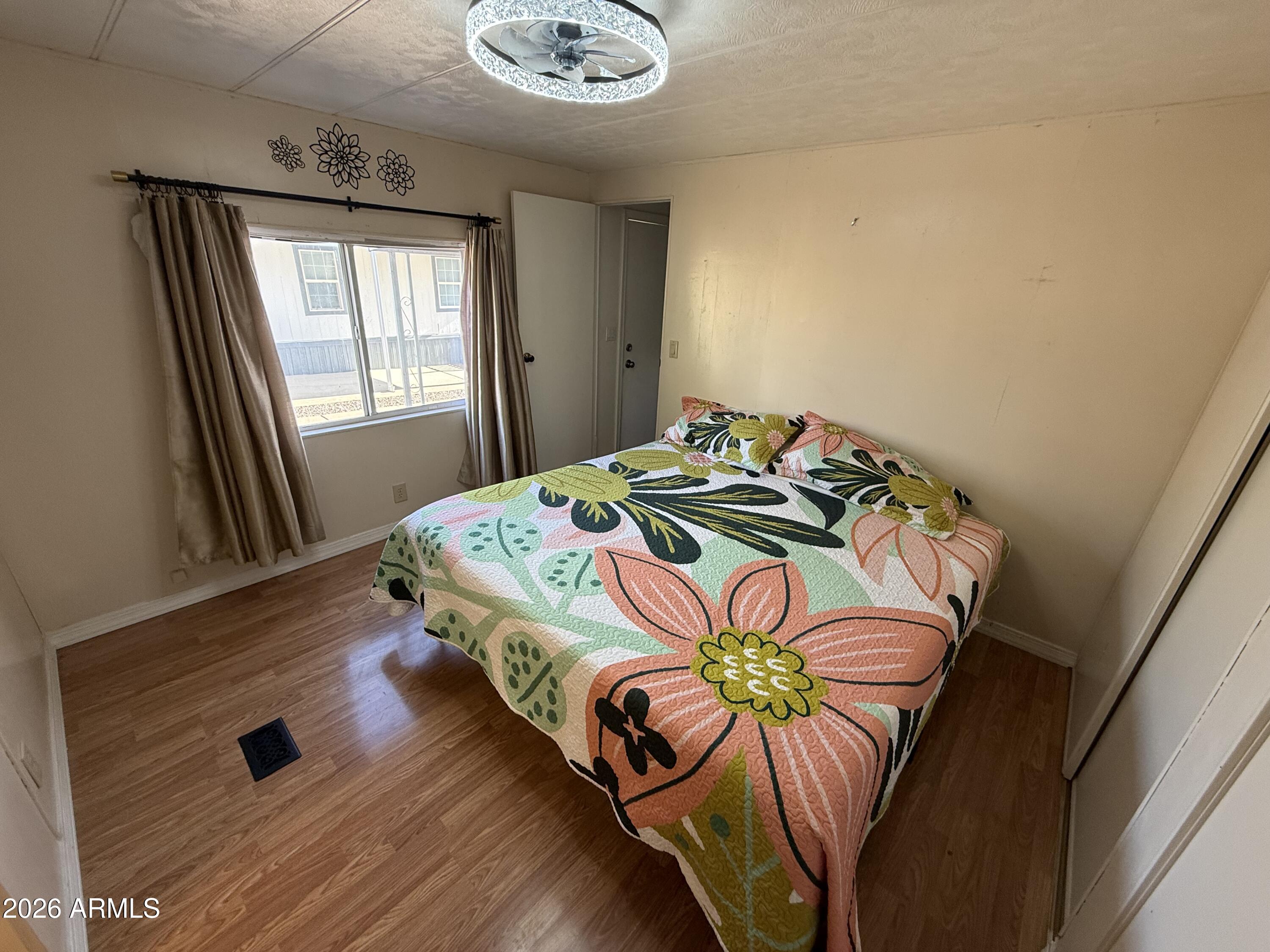 9501 East Broadway Road, Unit 48 Mesa, AZ 85208 - Photo 9 of 12 a bedroom with a bed and a window