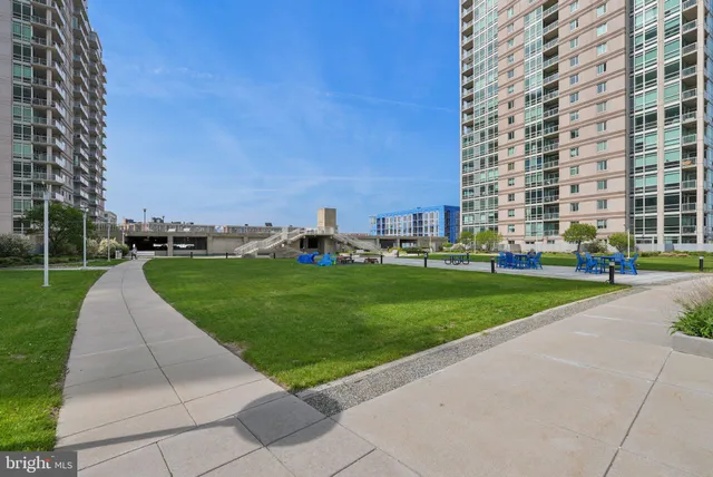 a view of a livingroom with furniture and a book shelf