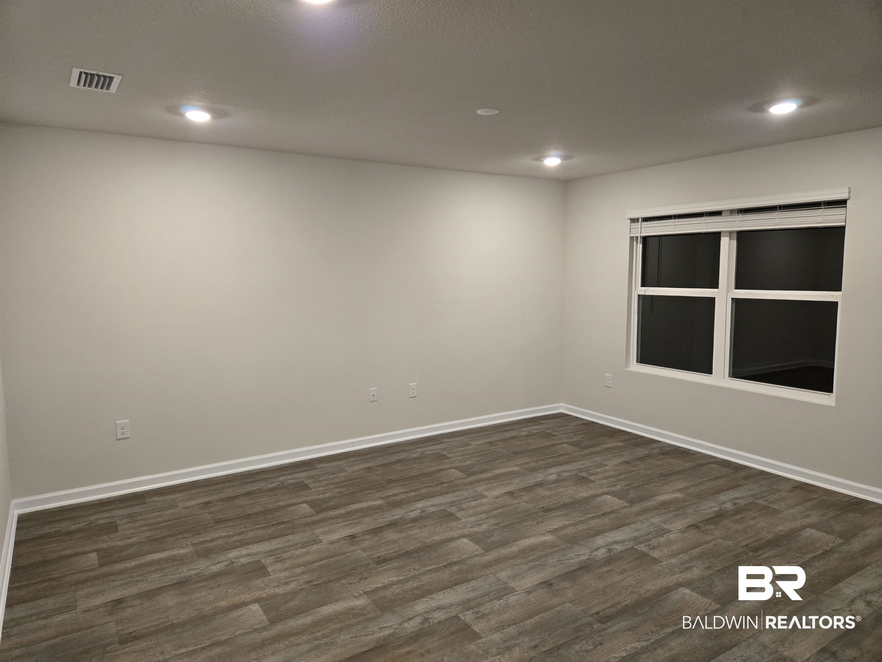 24194 Veranda Circle Elberta, AL 36530 - Photo 16 of 31 Spare room with dark wood-type flooring