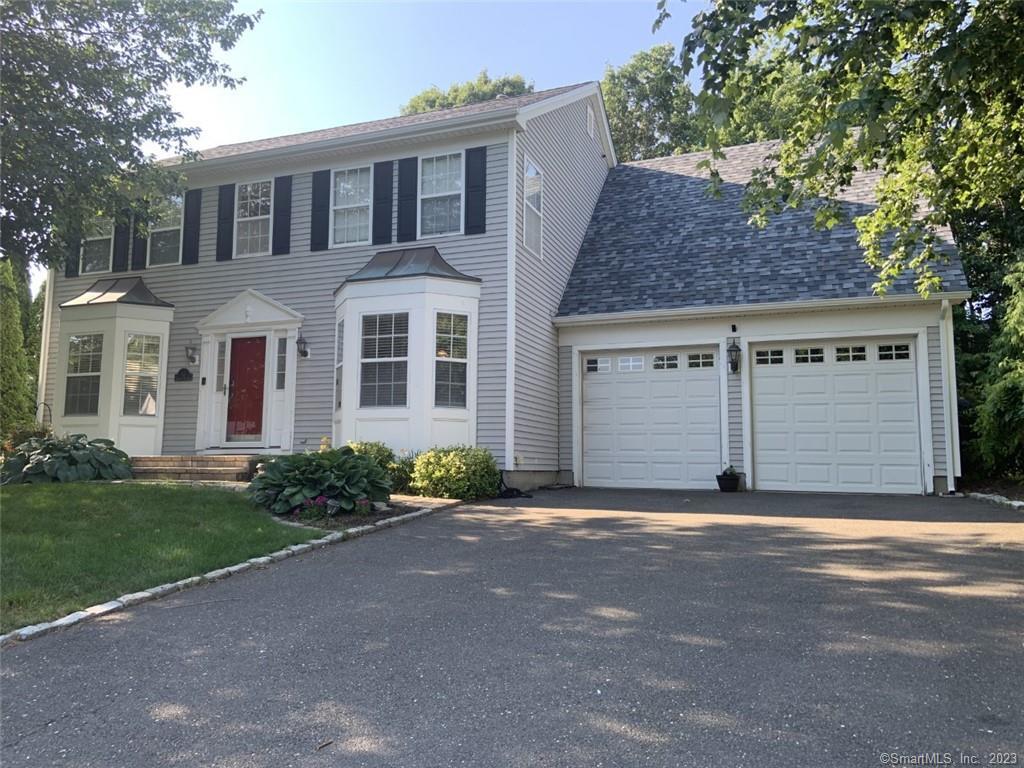 12 Lookout Hill Road Milford, CT 06461 - Photo 1 of 1 Front with two car garage and three steps to kitchen area.