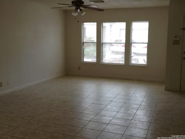 a kitchen with stainless steel appliances granite countertop a refrigerator a stove and a sink