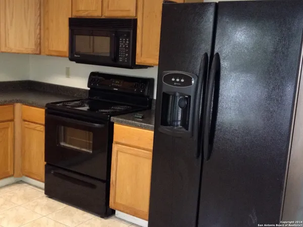 a kitchen with a stove and a microwave