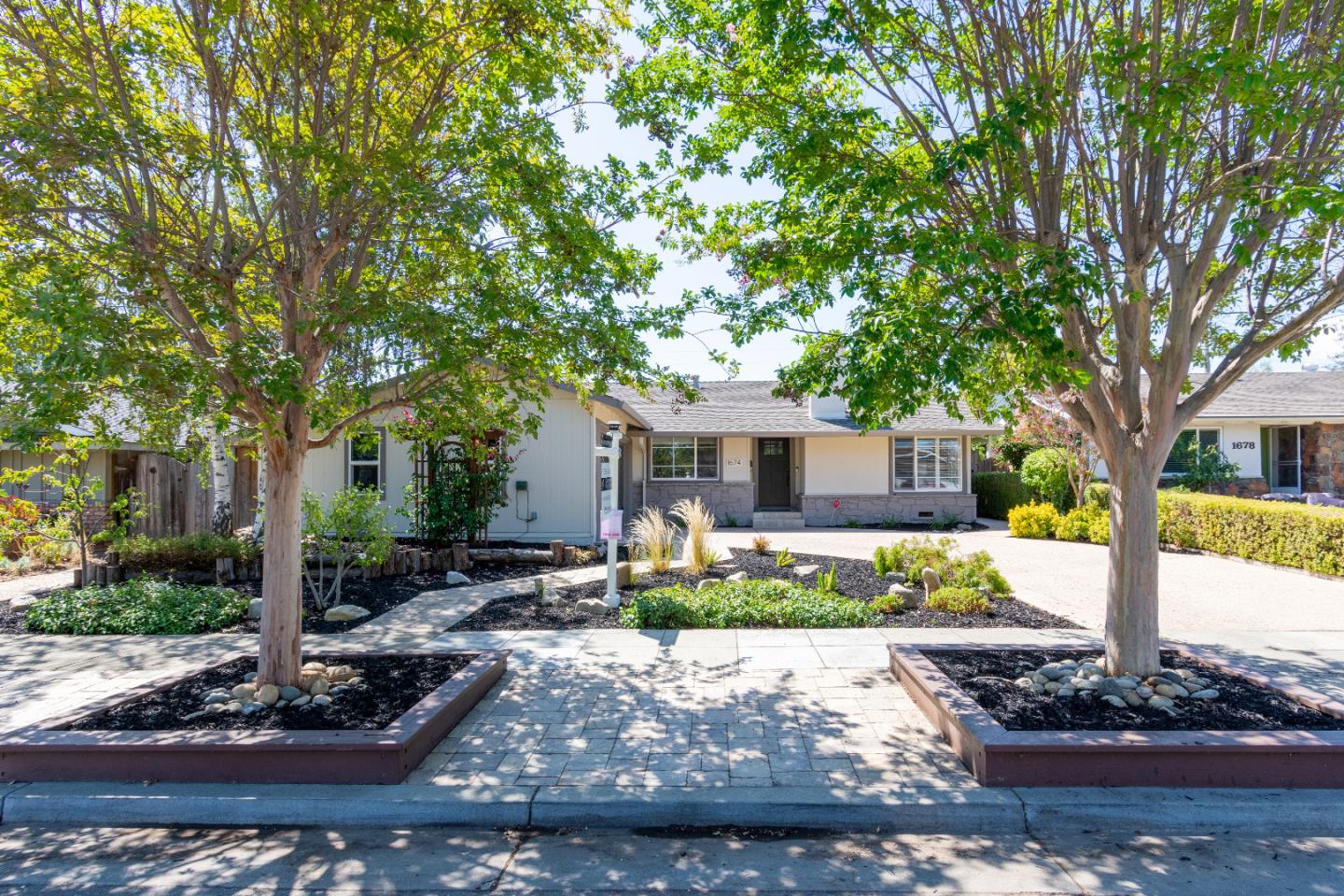 1674 Milroy Place San Jose, CA 95124 - Photo 2 of 12 a front view of a house with garden