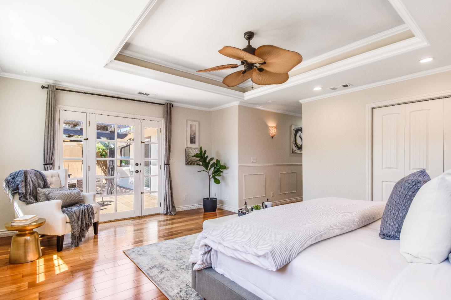 1674 Milroy Place San Jose, CA 95124 - Photo 7 of 12 a bedroom with a large bed and ceiling fan