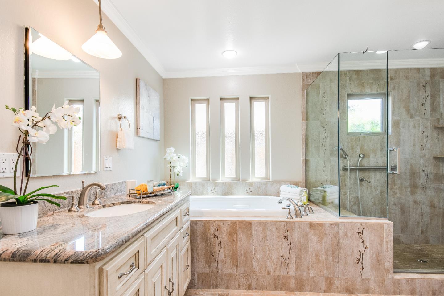 1674 Milroy Place San Jose, CA 95124 - Photo 8 of 12 a bathroom with a granite countertop tub sink and mirror