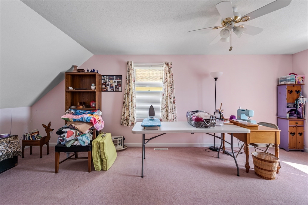 184 Russell Street Springfield, MA 01104 - Photo 21 of 28 a living room with furniture and a chandelier