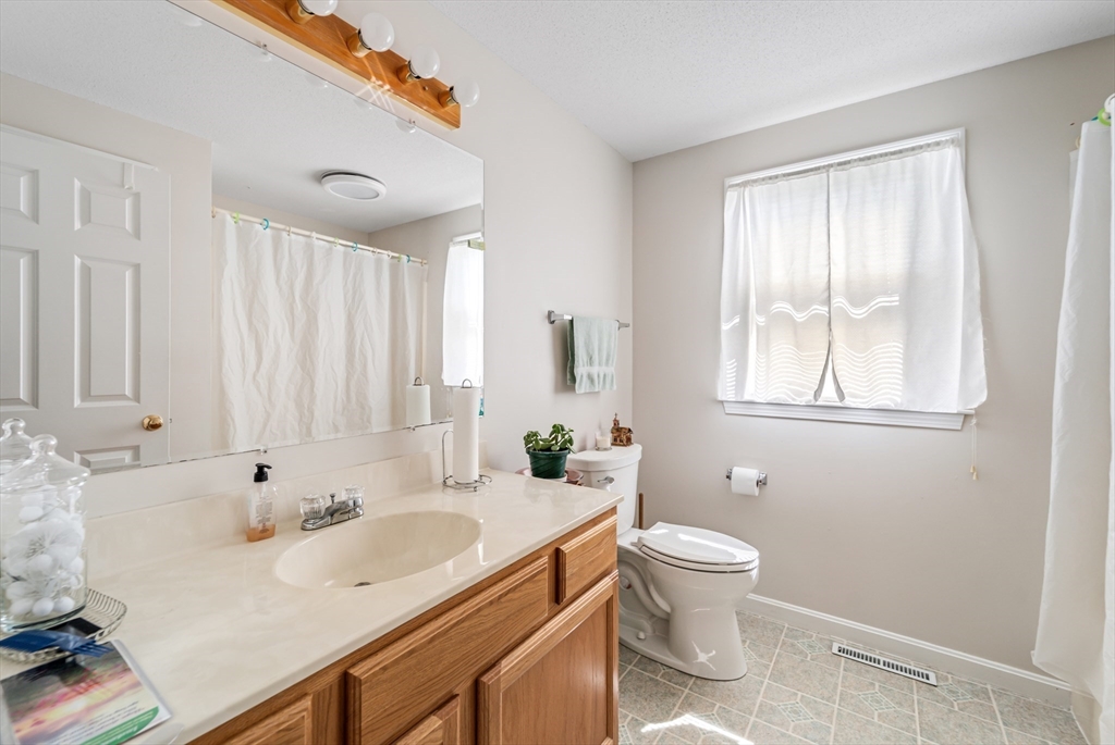 184 Russell Street Springfield, MA 01104 - Photo 7 of 28 a bathroom with a sink and a toilet