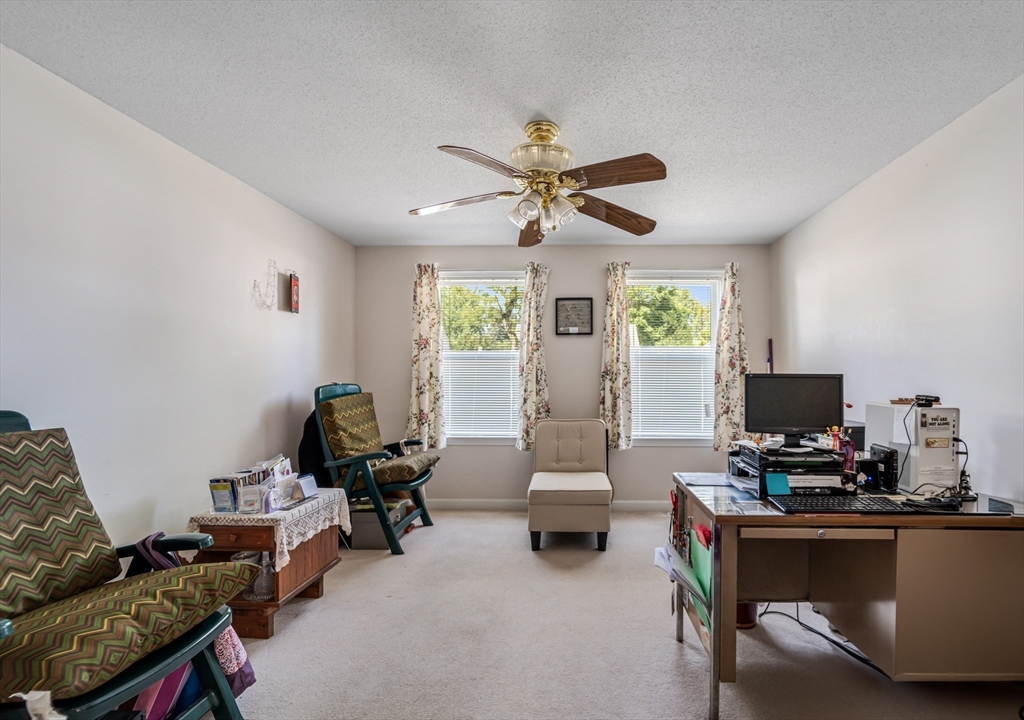 184 Russell Street Springfield, MA 01104 - Photo 9 of 28 a living room with furniture and a flat screen tv