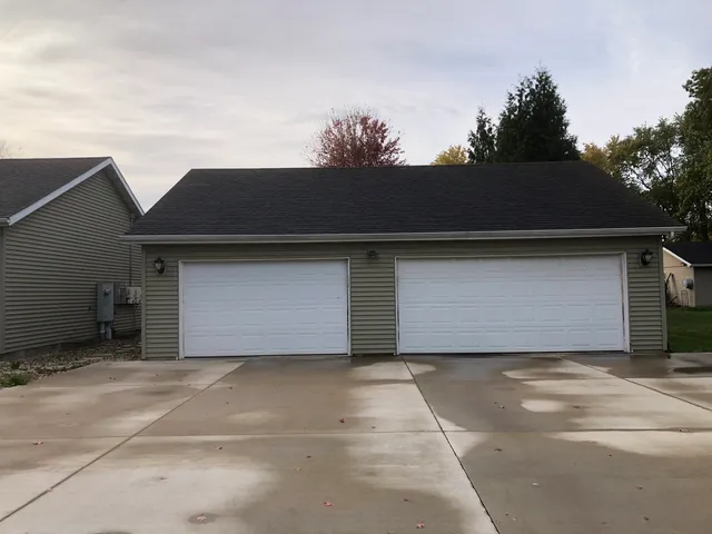 a front view of a house with garage