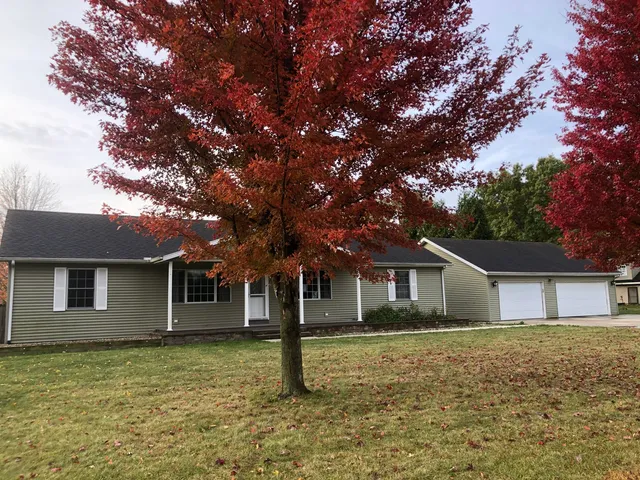 a house with trees in the background