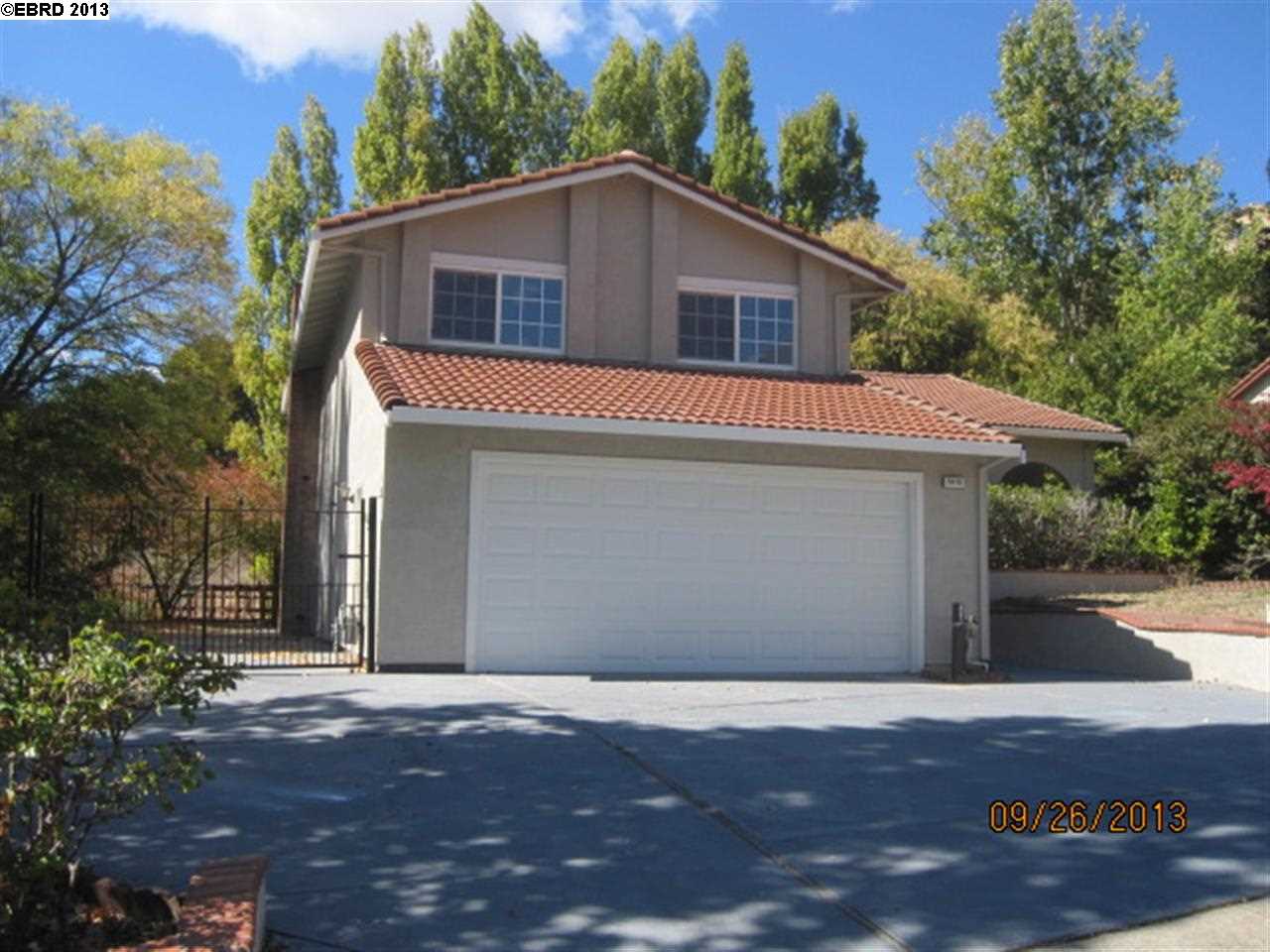 5916 Amend Road Richmond, CA 94803 - Photo 1 of 1 a front view of a house with a yard and garage