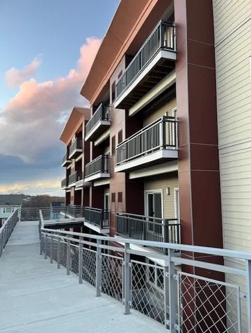 a front view of a building with many windows