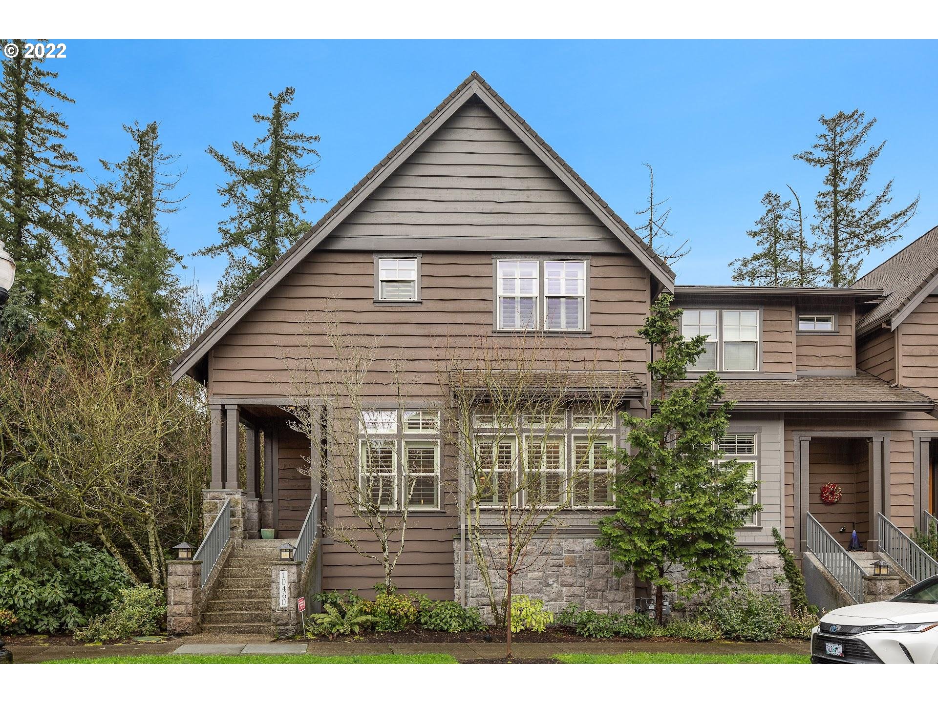 10460 Southwest Windwood Way Portland, OR 97225 - Photo 1 of 29 a view of a house with potted plants and more windows