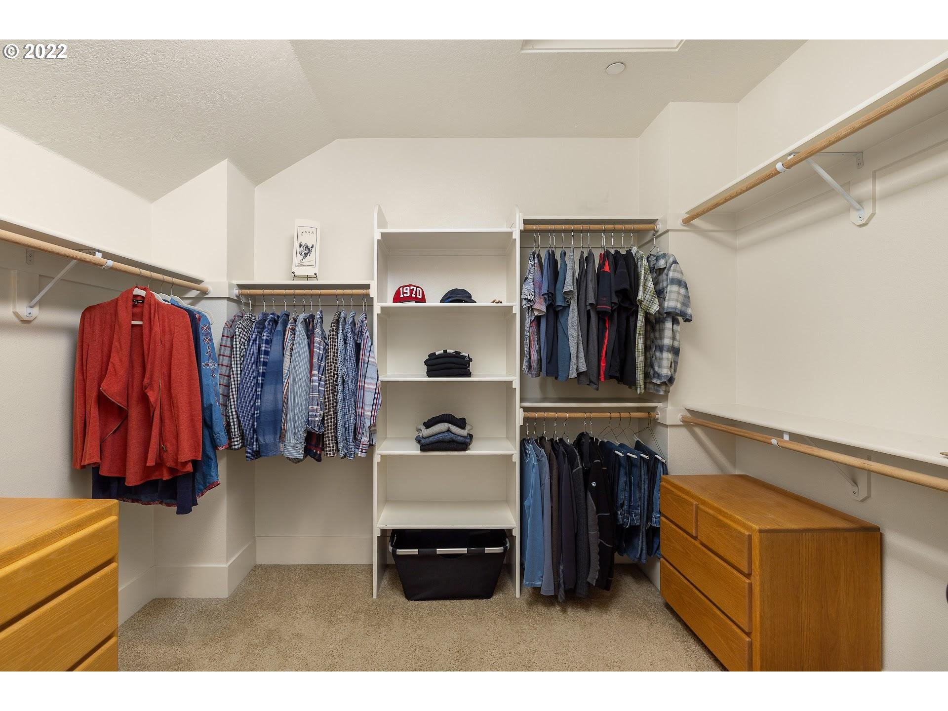 10460 Southwest Windwood Way Portland, OR 97225 - Photo 20 of 29 a view of walk in closet with clothes and shoes