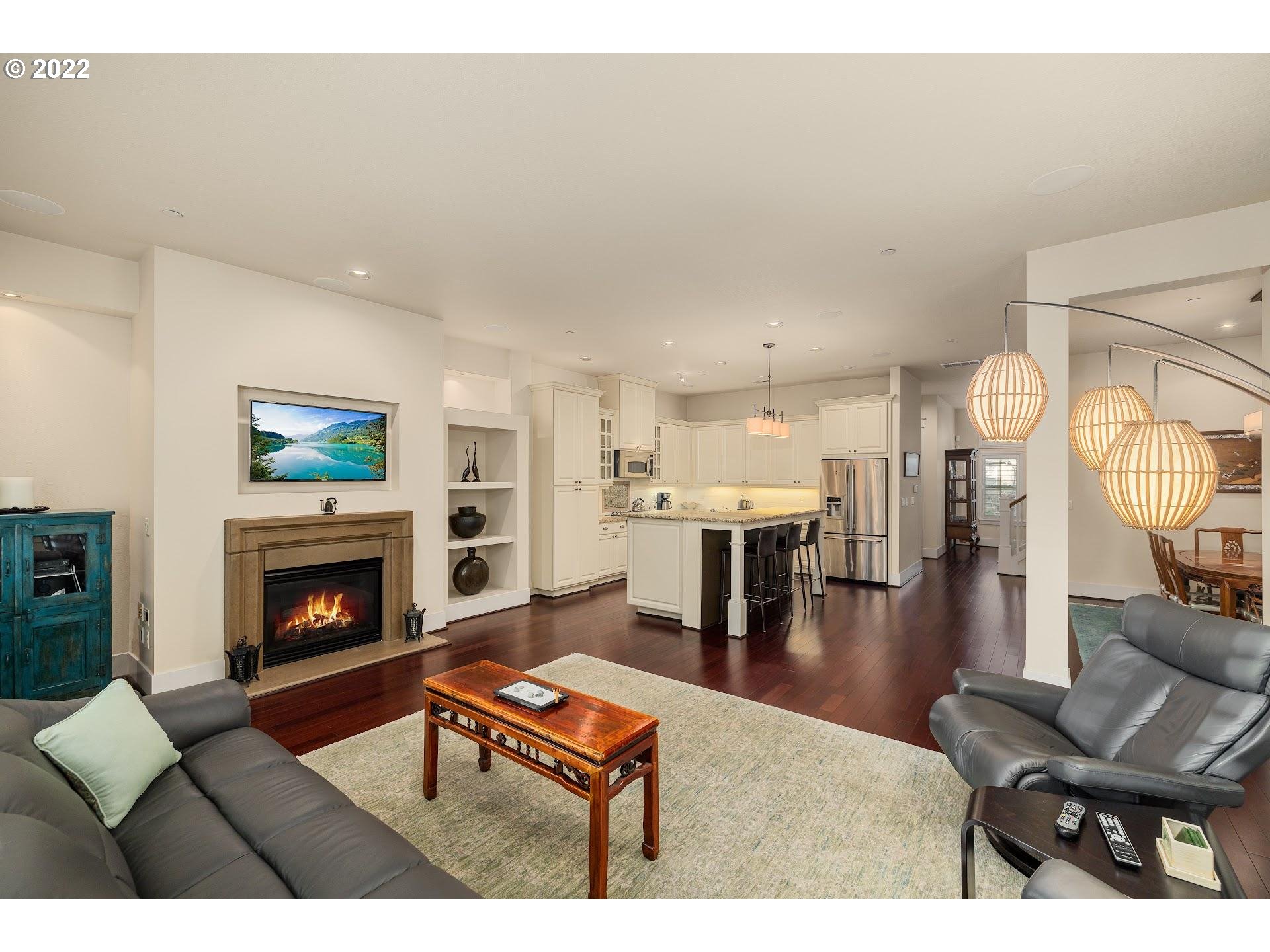 10460 Southwest Windwood Way Portland, OR 97225 - Photo 2 of 29 a living room with furniture a fireplace and a flat screen tv