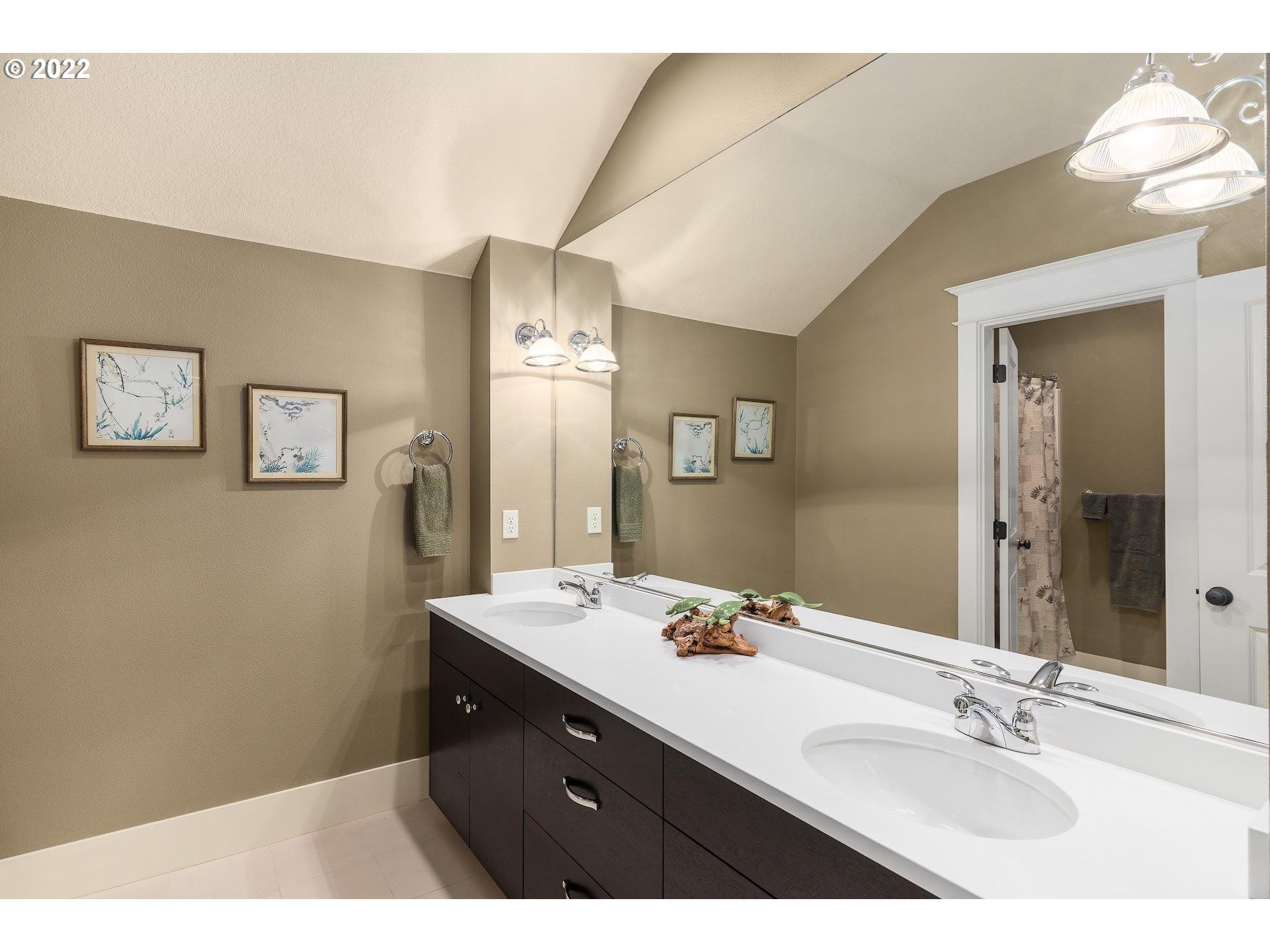 10460 Southwest Windwood Way Portland, OR 97225 - Photo 23 of 29 a bathroom with a sink and a mirror