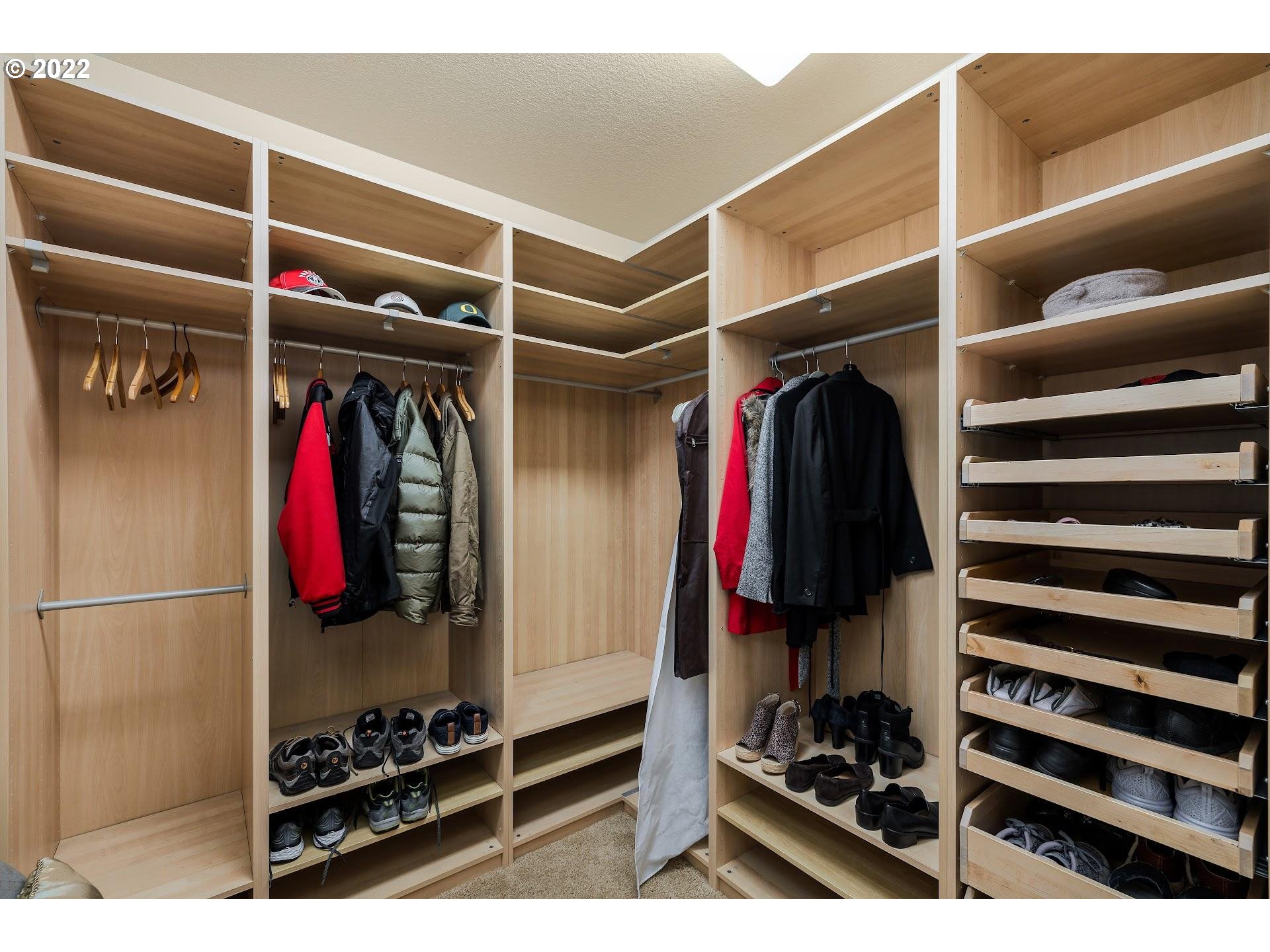 10460 Southwest Windwood Way Portland, OR 97225 - Photo 25 of 29 a view of walk in closet with clothes and shoes