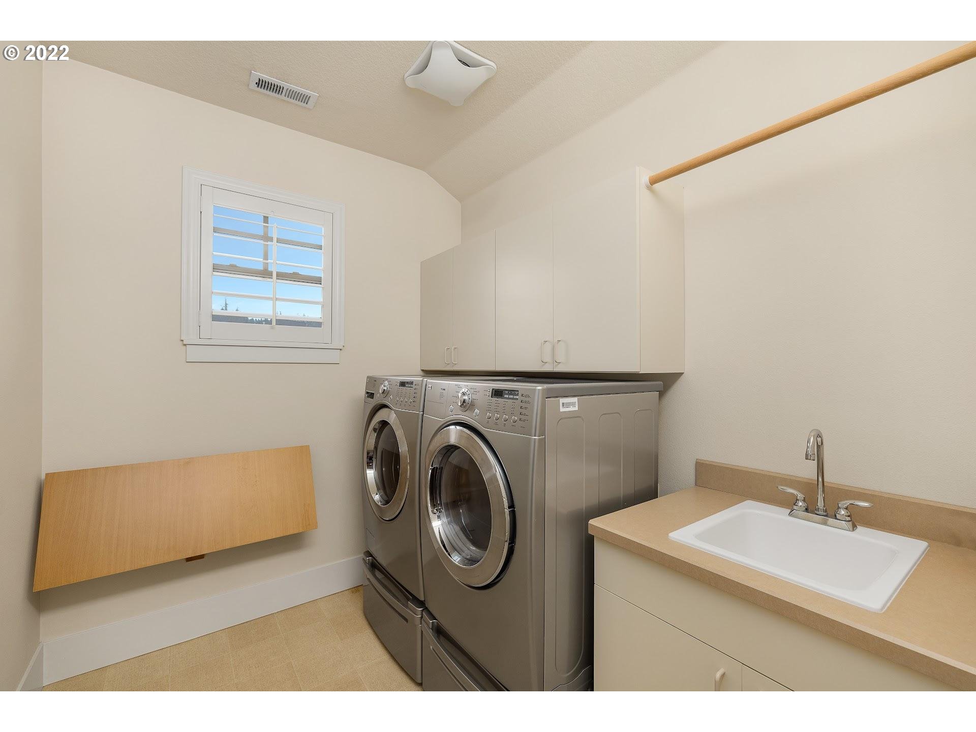 10460 Southwest Windwood Way Portland, OR 97225 - Photo 26 of 29 a utility room with dryer and washer