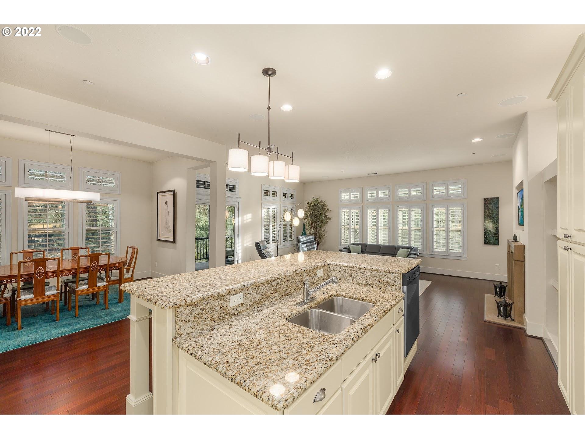 10460 Southwest Windwood Way Portland, OR 97225 - Photo 6 of 29 a view of a kitchen center island and living room