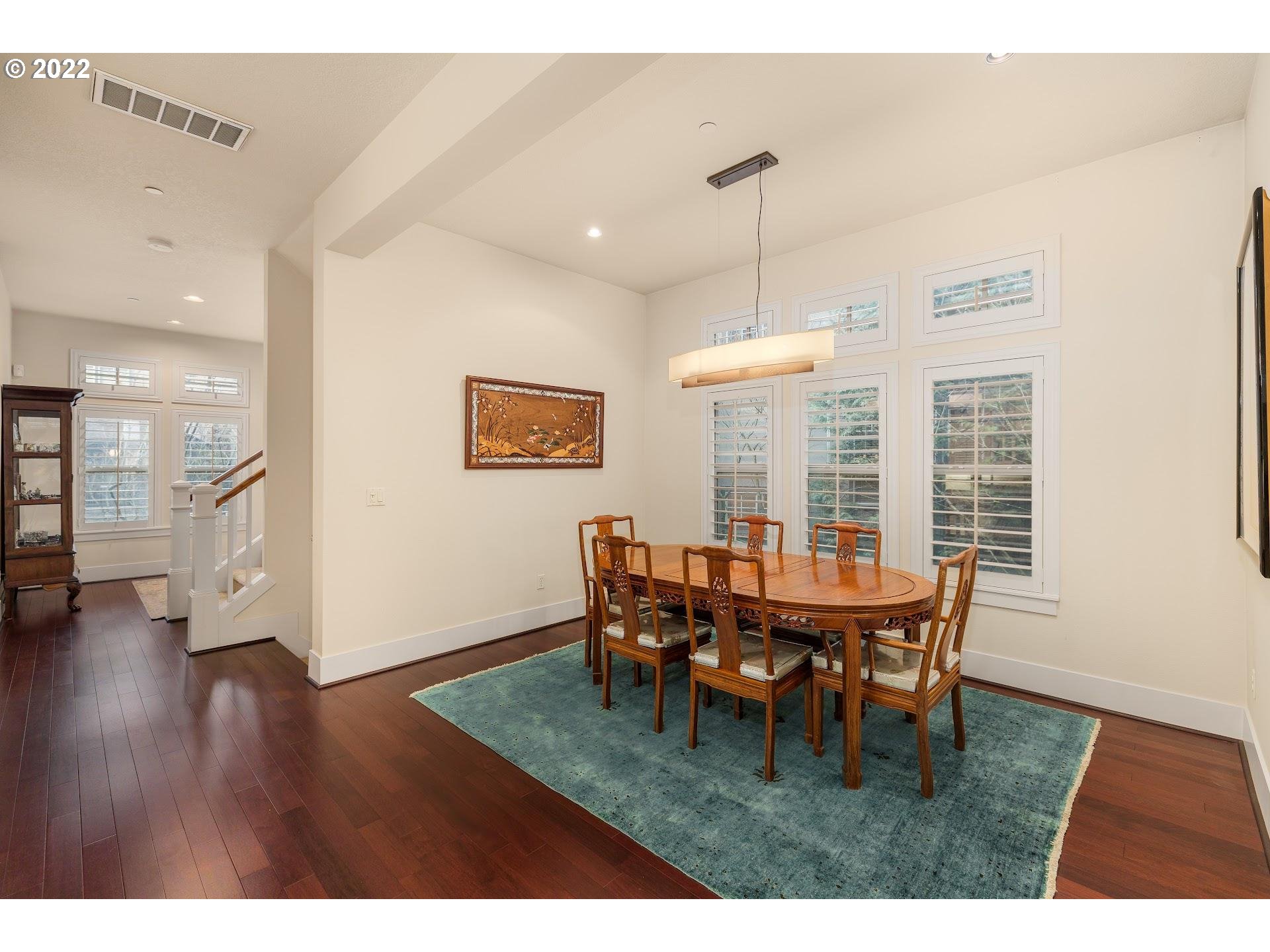 10460 Southwest Windwood Way Portland, OR 97225 - Photo 9 of 29 a dining room with furniture window and wooden floor