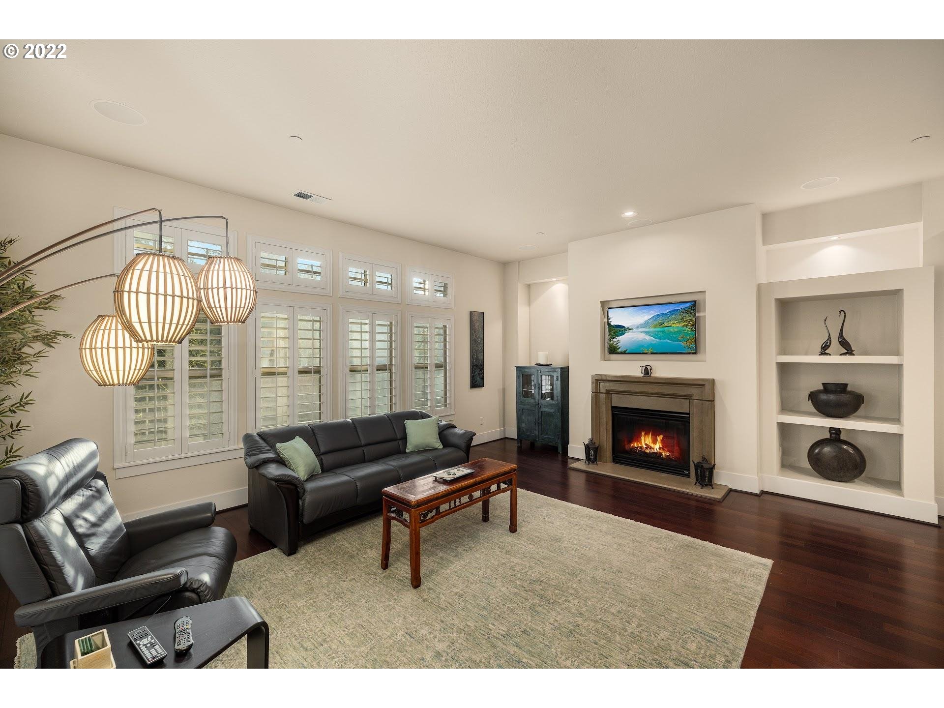 10460 Southwest Windwood Way Portland, OR 97225 - Photo 10 of 29 a living room with furniture and a fireplace