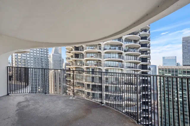 a view of a balcony with a floor to ceiling window