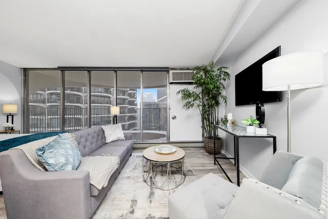 a living room with furniture and a rug