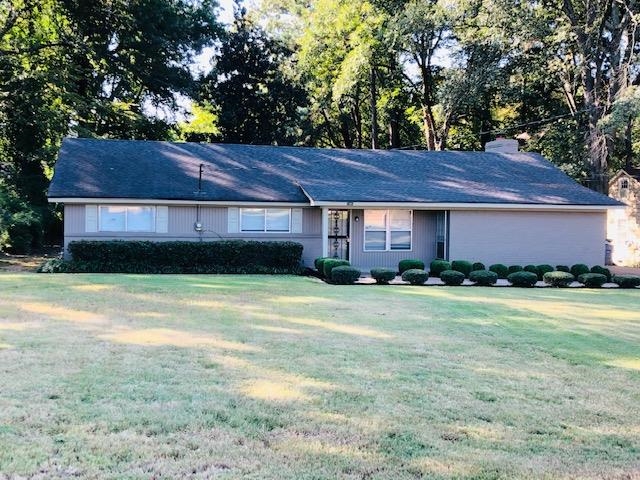 1381 Old Hickory Road Memphis, TN 38116 - Photo 1 of 24 a front view of a house with a garden