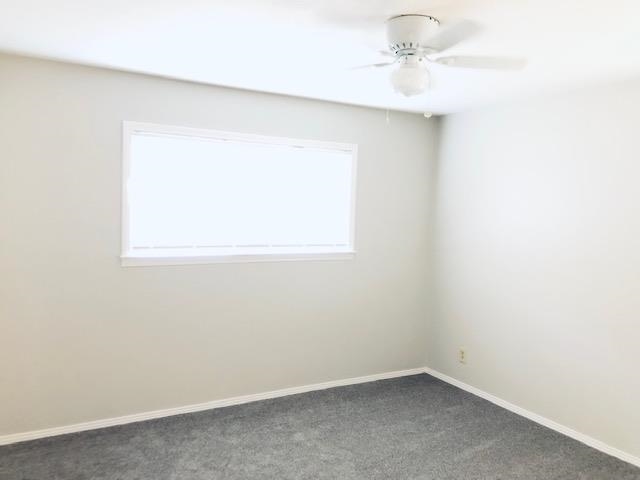 1381 Old Hickory Road Memphis, TN 38116 - Photo 19 of 24 an empty room with a window and a fan