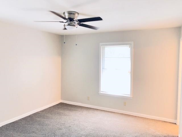 1381 Old Hickory Road Memphis, TN 38116 - Photo 21 of 24 an empty room with a window and a ceiling fan