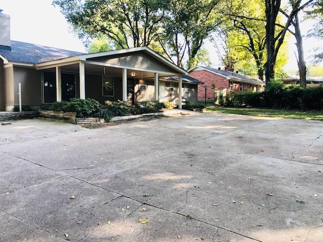 1381 Old Hickory Road Memphis, TN 38116 - Photo 5 of 24 a front view of a house with a garden