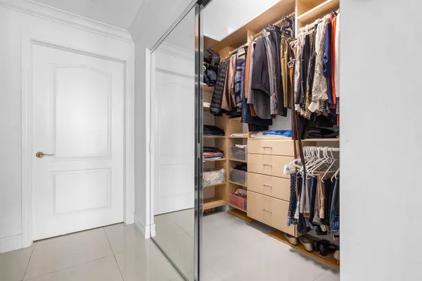 a view of a room with lots of chairs and couches