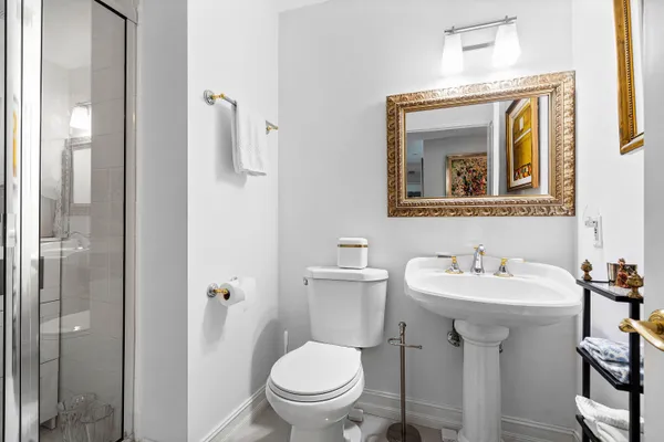 a living room with furniture a chandelier and a chandelier