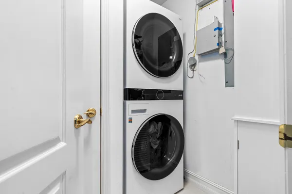 a view of a livingroom with furniture wooden floor and fan chandelier