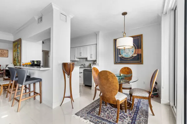 a kitchen with granite countertop a sink stove and cabinets