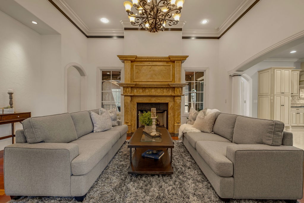 110 Devan Kishan Way Mount Juliet, TN 37122 - Photo 15 of 76 a living room with furniture a fireplace and a chandelier