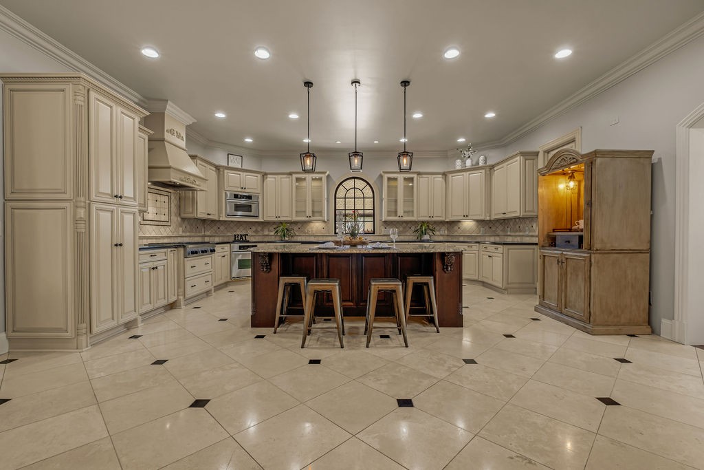110 Devan Kishan Way Mount Juliet, TN 37122 - Photo 18 of 76 a kitchen with stainless steel appliances kitchen island granite countertop a sink and cabinets