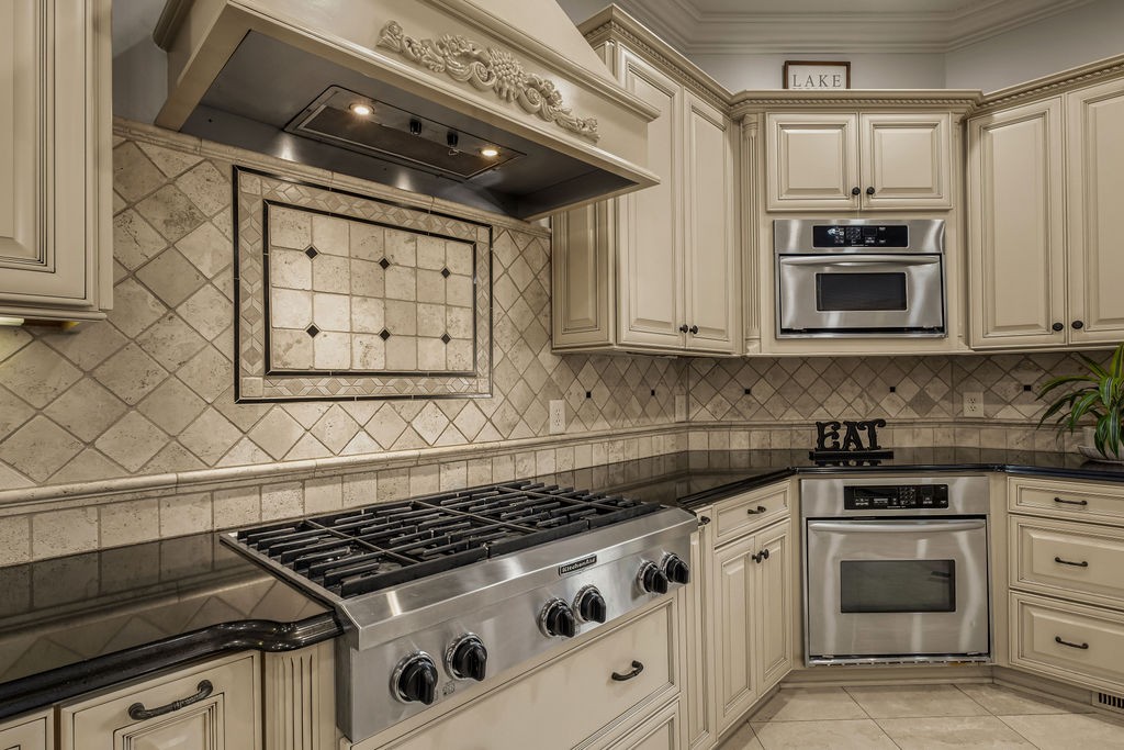 110 Devan Kishan Way Mount Juliet, TN 37122 - Photo 22 of 76 a kitchen with granite countertop a stove and a microwave