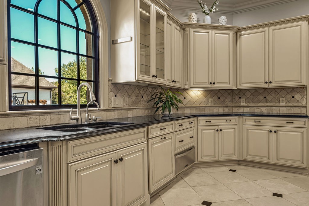 110 Devan Kishan Way Mount Juliet, TN 37122 - Photo 23 of 76 a kitchen with granite countertop a sink and white cabinets