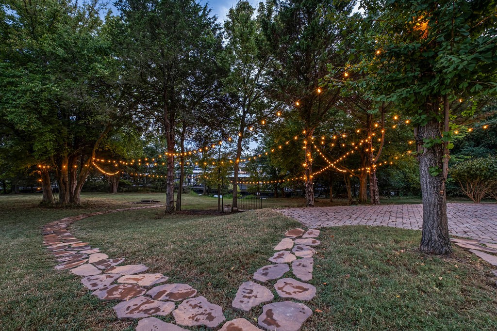 110 Devan Kishan Way Mount Juliet, TN 37122 - Photo 71 of 76 a view of a backyard with large trees