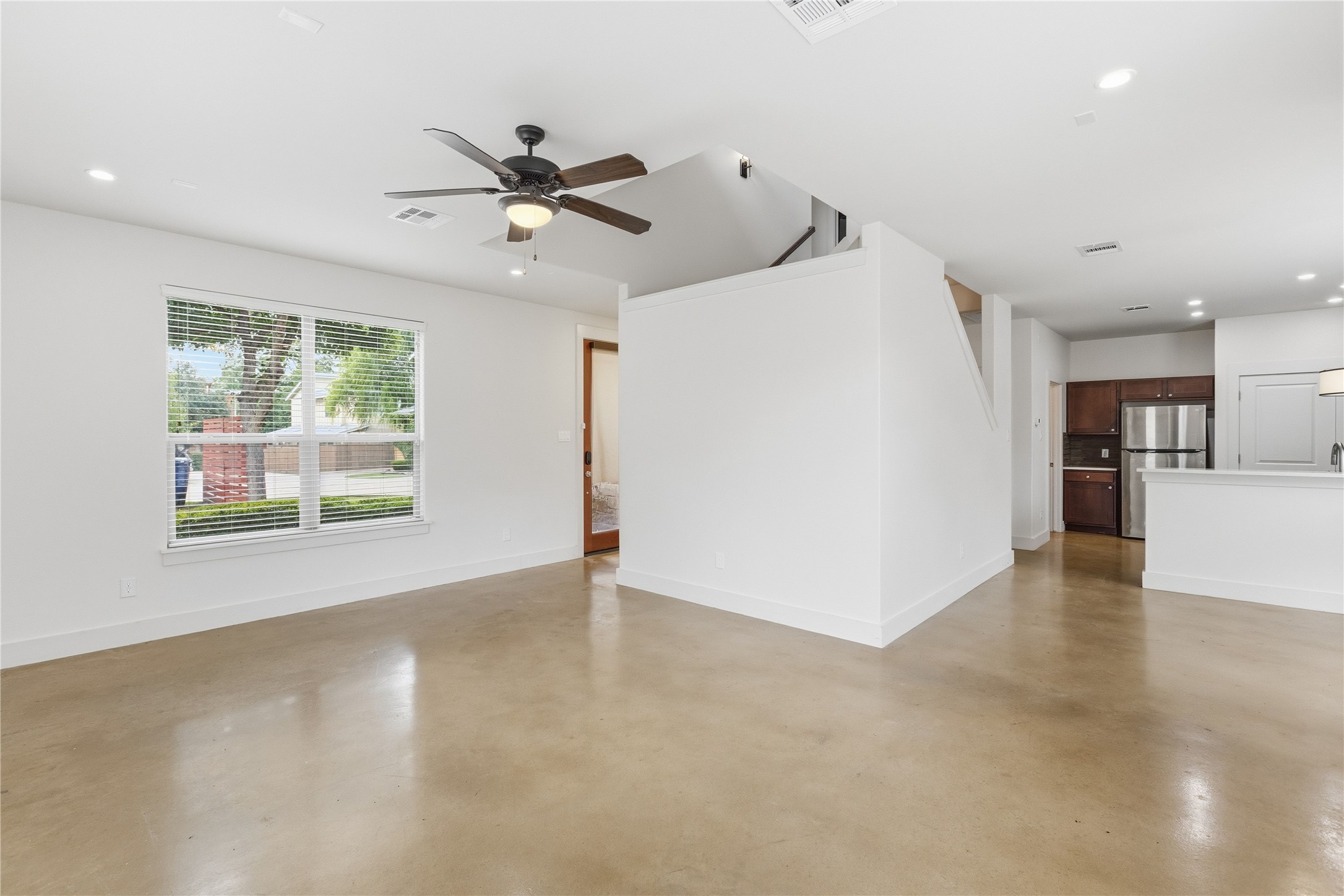4124 Valley View Road, Unit 4A & 4B Austin, TX 78704 - Photo 4 of 40 An open concept living area boasts a ceiling fan, recessed lighting, and polished concrete floors.