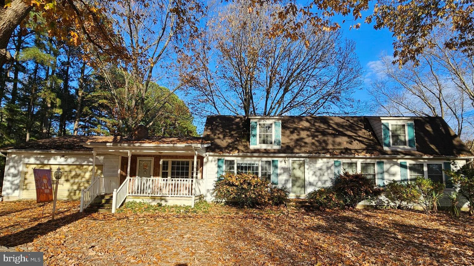 8210 Ingleton Circle Easton, MD 21601 - Photo 11 of 13 a front view of a house with a yard