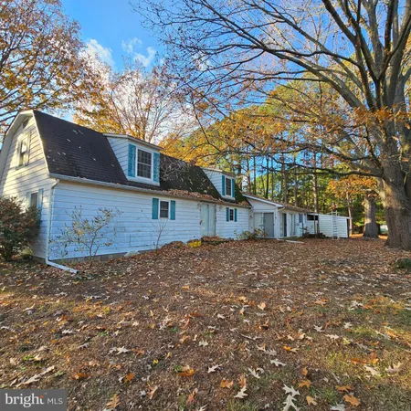 a house view with a backyard space
